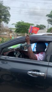 Arsenal supporters waving club flags during Premier League title celebrations in Abeokuta, Ogun State.
