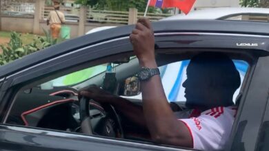 Arsenal supporters waving club flags during Premier League title celebrations in Abeokuta, Ogun State.