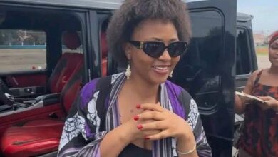 Regina Daniels looking amazed beside a luxury Brabus Mercedes-Benz G63 AMG reportedly gifted to her.