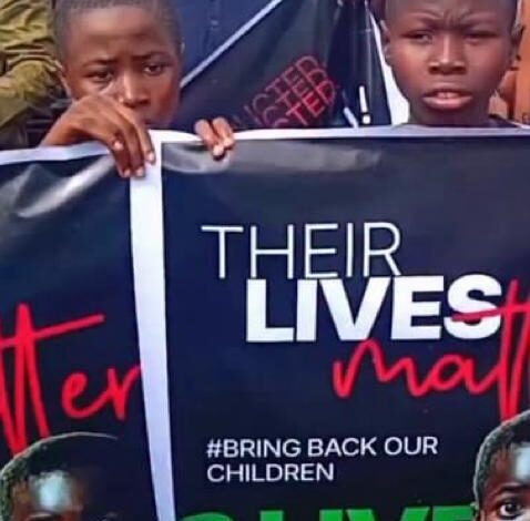Crowd of protesters in Ibadan, Oyo State holding placards demanding government action against insecurity and kidnappings in Nigeria.